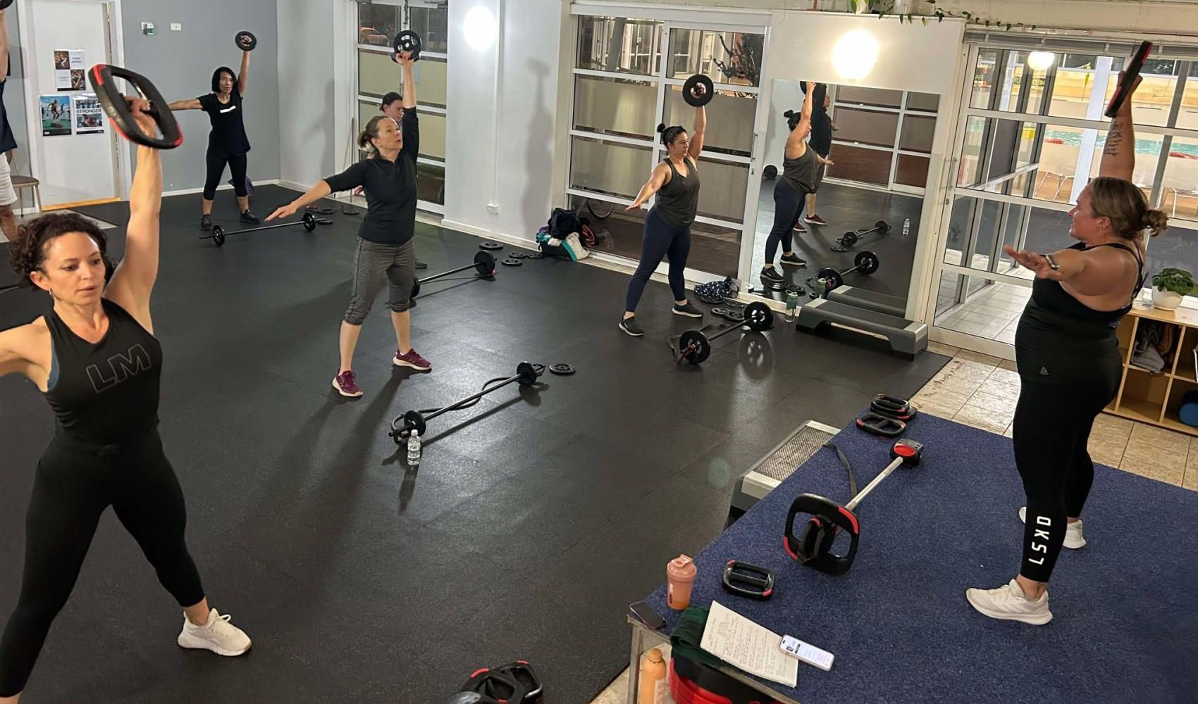 Instructor leads a Functional Strength group fitness class